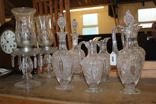 Cut glass claret set, comprising two pairs of graduated jugs, two decanters & 4 stoppers & pair lustre table lamps